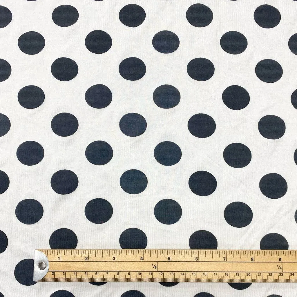 Black Spots on White Knit Fabric